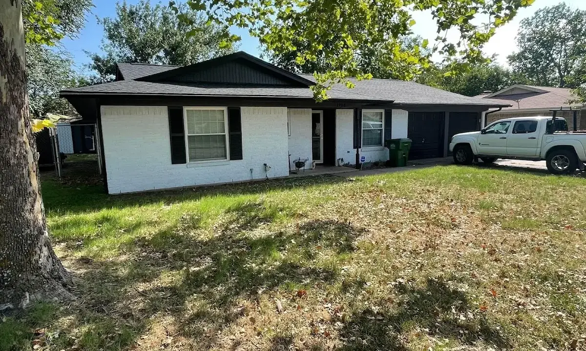 Professional roofing crew working on a residential roof in Streator